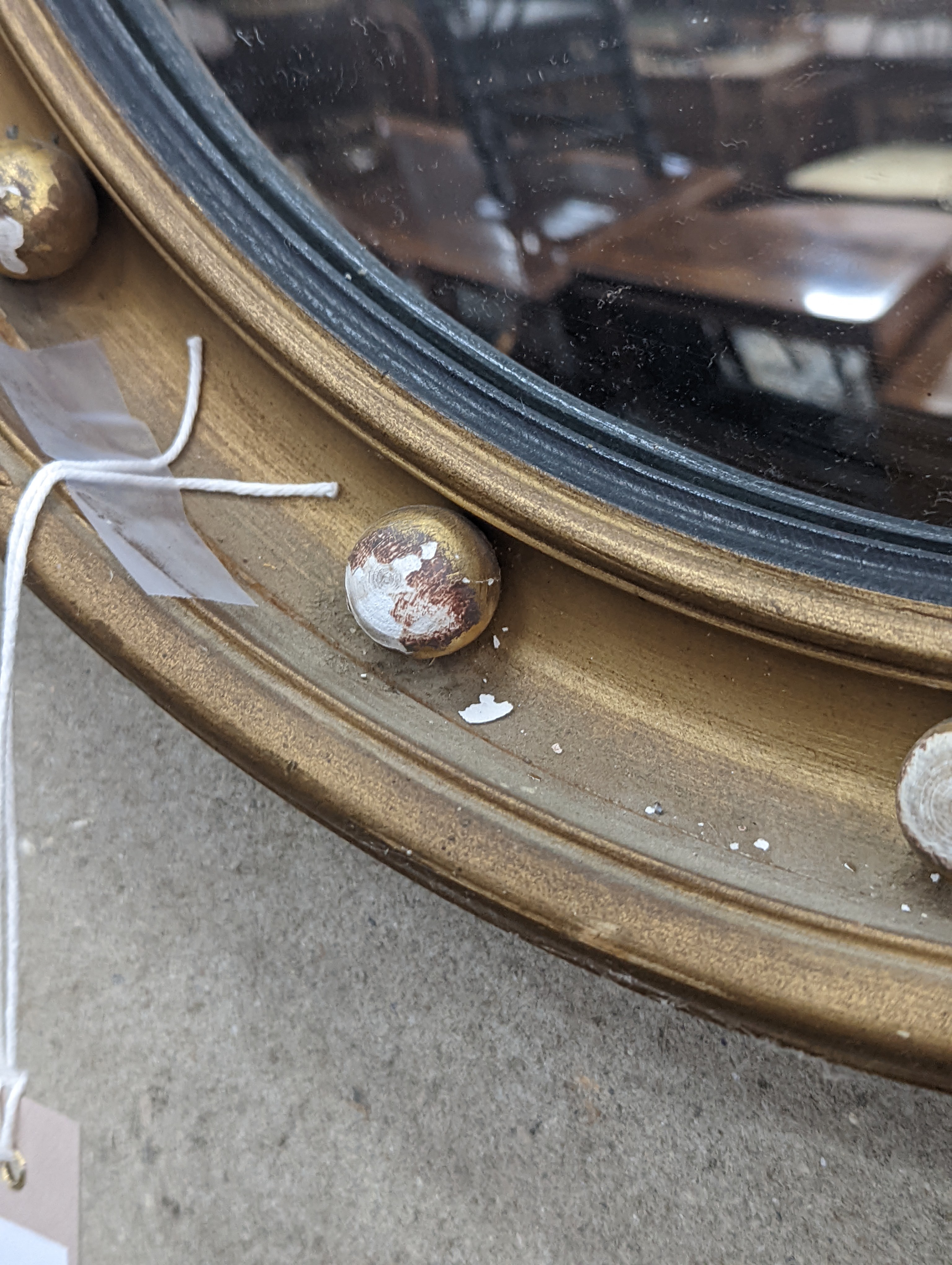 A Regency style circular gilt framed convex wall mirror, diameter 45cm